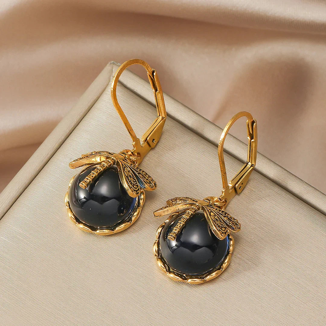 Sølv runde øreringe med en guldsmed