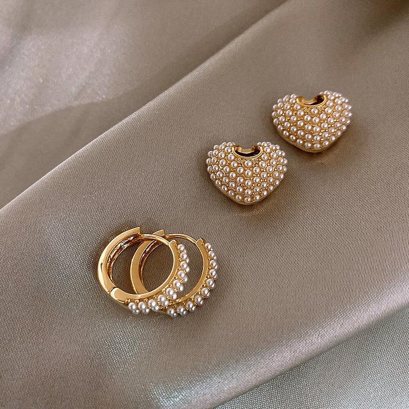 Perleøreringe i guld